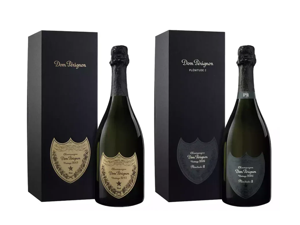 Two bottles of Dom Pérignon Champagne, each one new to its black gift box.